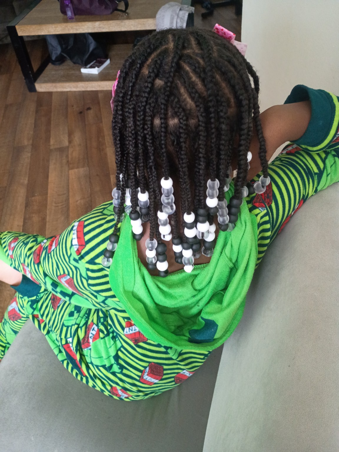 Children’s braided style with bows and beads